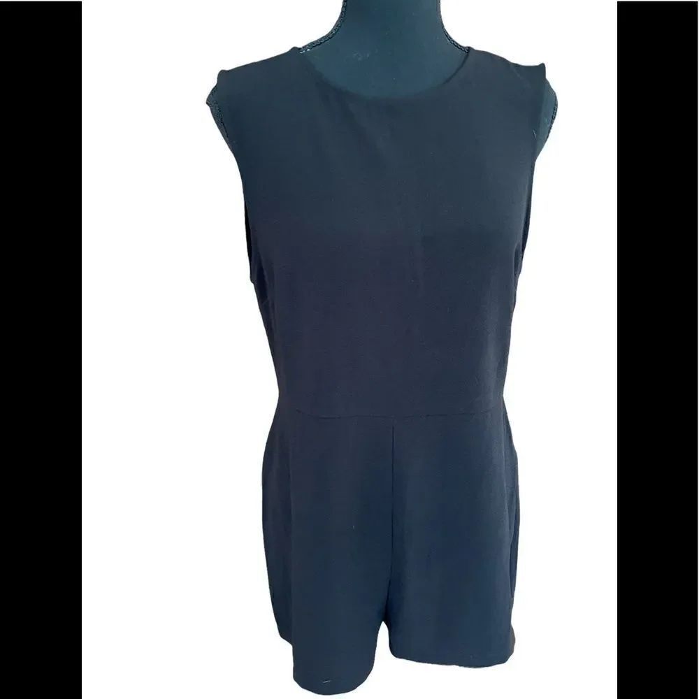 New with tags Forever 21 black romper with open back, size M